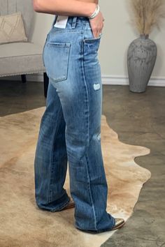 The Hank ~ Wide Leg Distressed Jeans for that Retro Loving Style! ~ High Rise - 11" ~Wide Leg ~Medium Wash ~Distressed detail on front legs ~Inseam - 34" (Longer Length) ~hidden button fly ~100% Cotton ~Kancan Laney is a size 6 wearing a 7/27 Wide Leg Denim Outfit, Outfits With Wide Leg Jeans, Womens Western Outfits, Wide Leg Distressed Jeans, Mom Things, Horseshoe Pendant, Western Jeans, Boring Clothes, Work Party