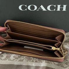 This Listing Is For The Coach Wallet! Zipper Closure With Hand Strap! Zipper Compartment Inside! Twelve Card Holders! Two Bill Compartments! Coach Travel Wallet With Zipper Closure, Coach Travel Wallets With Zipper Closure, Coach Wallets With Zipper Closure For Travel, Coach Clutch With Zipper For Daily Use, Coach Wallets With Zipper Closure For Everyday Use, Coach Wallets With Zipper Closure, Chic Wallets With Zipper Pocket, Chic Coach Wallet With Zipper Closure, Coach Leather Wallets With Zipper Closure