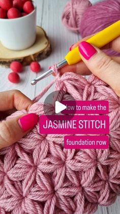 someone is crocheting the stitchs on a pink yarn ball with a yellow needle