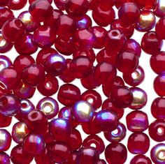 red glass beads on white background