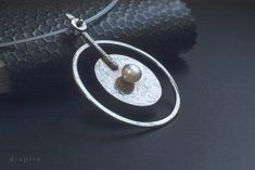 Large geometric necklace silver round pendant. Α well balanced geometric necklace made out of fine Sterling, and natural freshwater Pearl. Height: 2.36'' Width: 1.77'' Chain's length: 16.53'' Here are the matching earrings: https://www.etsy.com/listing/258131115/silver-stud-earrings-fresh-water-pearls?ref=shop_home_active_79&sca=1 Get a 10% discount off your next order by subscribing at Diapiro's newsletter. Link for coupon code https://mailchi.mp/56f529763263/diapiro All of my products are Silver Minimalist Pearl Necklace With Round Pendant, Modern Pearl Pendant Necklace, Modern Silver Pearl Necklace With Pearl Drop, Modern Sterling Silver Pearl Necklace Gift, Modern Silver Necklace With Pearl Pendant, Modern Silver Pearl Necklace With Charm, Modern Handmade Pearl Jewelry, Minimalist Silver Metal Pearl Necklace, Modern Silver Jewelry With Pearl Drop