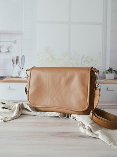 Elevate your style with our Faux Brown Leather Crossbody Bag, a soft and vegan-friendly sling that seamlessly combines fashion and compassion. Crafted for comfort and durability, this versatile bag is perfect for your on-the-go lifestyle. The rich brown faux leather adds a touch of sophistication, while the adjustable strap ensures a personalized fit. With multiple pockets for organization, this crossbody bag is both stylish and practical. Choose cruelty-free fashion with this chic accessory, designed for the conscious and trendsetting individual. One zippered exterior pocket and 3 small slot pockets on the inside of the bag. The Pink lining comes with a front zipper with cream zipper tape, the cream and teal linings come with the dark brown zipper tape. Measurements Width: 8 inches Hight: Versatile Everyday Crossbody Camera Bag, Everyday Versatile Flap Bag, Versatile Brown Camera Bag For Daily Use, Versatile Soft Leather Crossbody Flap Bag, Versatile Flap Bag With Adjustable Strap, Everyday Saddle Bag With Magnetic Closure, Everyday Camera Bag With Detachable Strap, Everyday Shoulder Bag With Magnetic Closure, Versatile Everyday Flap Bag