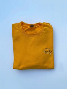 JUST RESTOCKED :) Premium embroidered crewneck sweatshirt. Made with a classy triad of colors, the design is embroidered onto a high quality butter-yellow crewneck. Please refer to the size guide in the listing for sweatshirt measurements. If you have any questions, please feel free to message me :) If there's a specific size+color you would like but it's out of stock, please message us! I'll try my best to accommodate :) Comes with freebies :) Yellow Crew Neck Tops With Embroidered Logo, Yellow Cotton Top With Embroidered Logo, Yellow Crew Neck Relaxed Fit Sweatshirt, Yellow Relaxed Fit Crew Neck Sweatshirt, Yellow Cotton Crew Sweatshirt, Yellow Crewneck, Heart Sweatshirt, Butter Yellow, Embroidered Crewneck