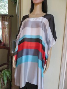 Brighten up your summer with this silky tunic.  You can wear it as a dress or a top over pants, leggings or jeans.  Also makes a great summer coverup for those days at the pool or beach., One size.  Fits small to medium sizes.  The width is 35 inches, edge to edge, 70 inches around the body.  The side seams are 5 inches from the edge, giving  50 inches for body room.  The length is 36 inches.  The fabric is 20% silk and 80% polyester.  The neckline is hand finished.  Hand wash.  Hang to dry. Summer Cover Up, Striped Tunic, Womens Tunics, Top Dress, Dress Clothes For Women, Striped Dress, Tunic Tops, Cover Up, Dress Outfits