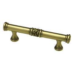 an antique brass handle on a white background