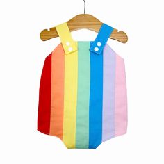 Baby retro rainbow romper. Poppers for easy changing, relaxed fit, plenty of room for nappies (cloth or disposable). Fully lined with light soft cotton. Seamless insides making them comfortable against babies skin. Rainbow design made up of carefully selected colours of 100% premium quality cotton. Adjustable length straps. Multicolor Bubble Romper For Summer Playtime, Multicolor Cotton Bubble Romper For Playtime, Playful Multicolor Bubble Romper For Summer, Multicolor Jumpsuits And Rompers For Summer Playwear, Playful Multicolor Bubble Romper For Playtime, Spring Multicolor Onesie For Playtime, Multicolor Cotton Onesie For Summer, Cute Multicolor Cotton Bubble Romper, Cute Multicolor Jumpsuits And Rompers For Playtime