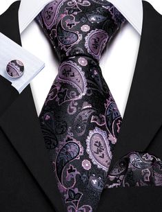 Make a statement at your next formal event with our high quality Black Purple Paisley Silk Tie Pocket Square Cufflink Set. Perfect for weddings or any occasion that calls for formal wear, this set is sure to elevate your look and make you stand out in the crowd. Made from luxurious silk, the tie features a bold paisley pattern in black and purple, while the pocket square and cufflinks perfectly coordinate to complete the look. 100% Silk Handmade Package Includes: Tie, Pocket Square & Cufflinks. Classic Silver Cufflinks For Black Tie Events, Luxury Silver Suit And Tie Accessories For Business, Elegant Black Cufflinks For Father's Day, Elegant Silver Suit And Tie Accessories For Formal Events, Luxury Silver Suit And Tie Accessories For Formal Occasions, Silver Elegant Suit And Tie Accessories For Gift, Elegant Silver Suit And Tie Accessories For Gift, Elegant Black Cufflinks For Business, Elegant Black Cufflinks For Wedding