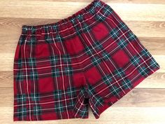 "ATTENTIONWE ARE AT FULL CAPACITY FOR  DELIVERY BY CHRISTMAS FOR 2023 . You can still place an order, however..we can not guarantee that it will ship, or that you will  receive it by Christmas Day!Listing is one pair of Christmas Red Traditional Tartan Plaid Flannel Shorts! You can find the matching pants here: https://www.etsy.com/listing/1277105502/christmas-red-green-and-black-tartan?click_key=2f6d24366a437ab3af1b2ace73ad93e767b837fe%3A1277105502&click_sum=53849096&ref=shop_home_active_3&frs=1&sts=1   - 100% Cotton Flannel - 1/2 inch elastic waistband - available w/wo a bow accent at waist -Handmade here in Virginia by me. How do you find your size????? measure your hips and then look at \"my\" size chart, Women's Waist: XS (25-27) S(28-29) M(29-30 L(31-32) XL(32-33) XXL(34-36) inches H Vacation Shorts, Flannel Shorts, Black Tartan, Flannel Pajamas, Sleep Shorts, Matching Pants, Christmas Red, Christmas Pajamas, Pajama Shorts