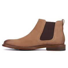 The Lyle is a stylish Chelsea boot that is a must-have for everyone. Crafted from genuine leather, it promises durability and timeless elegance throughout the seasons. With its sleek silhouette and comfortable fit, the Lyle boot offers versatile style for any occasion. Whether paired with jeans or dressed up for a formal event, its classic design ensures you always look polished and refined. Elevate your footwear collection with the enduring appeal and quality craftsmanship of the Lyle. Fall Chelsea Boots With Stitched Sole And Plain Toe, Rugged Plain Toe Chelsea Boots For Business, Masculine Brown Chelsea Ankle Boots, Leather Chukka Boots For Fall, Classic Suede Chelsea Boots With Moc Toe, Suede Chelsea Boots With Leather Sole For Business, Brown Chelsea Boots With Stitched Sole And Plain Toe, Brown Chelsea Boots With Leather Footbed For Business, Business Chelsea Boots With Suede Lining In Calf Leather