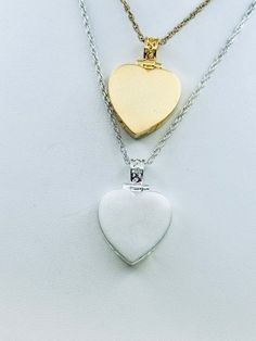 This beautiful heart pendant with satin finish is a unique way to hold a loved one's close with 2 compartments.  This pendant can hold a small amount of cremains, lock of hair, or dirt from the sacred burial grounds. This piece comes on an 18" matching chain, 3/4 inch size GOOD TO KNOW: ♥ Available in 14k plated gold or a Sterling Silver ♥THIS PENDANT CAN BE ENGRAVED-SEE PERSONALIZATION SECTION ♥Fill kit included with pendant PACKAGING: ♥The pendant comes in a small jewelry box that can easily b Double Heart Locket Necklace For Keepsake, Double Heart Locket Necklace Keepsake, Double Heart Charm Locket Necklace For Wedding, Double Heart Locket Necklace With Heart Charm For Wedding, Valentine's Day Heart Cut Keepsake Locket Necklace, Heart Shaped Locket Necklace For Memorial, Double Heart Locket Necklace For Anniversary, Double Heart Locket Necklace For Wedding, Engraved Double Heart Necklace For Memorial