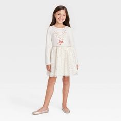 Update their occasion-ready style with this Long-Sleeve Tulle Dress from Cat & Jack™. This long-sleeves tulle dress makes a perfect outfit for party wear or holidays. It features a shimmery elastic waist and a lightweight mesh skirt with full lining for comfy wear, while the pullover crewneck allows for easy dressing. They can pair this dress with sparkly ballerina shoes or layer with tights and a cardigan during the cooler months.

Cat & Jack™: Classics with an imagination of their own. Simple Christmas Dress, Outfit For Party, Long Sleeve Tulle Dress, Girls Matching Dresses, Santa Experience, French Terry Dress, Red Christmas Dress, Girls Holiday, Comfy Wear