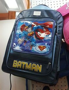 a back pack with superman and the flash on it