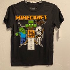 Boy’s Minecraft Halloween Short Sleeved Graphic Tee. Condition Is Brand New With Tags! Sizes Available: X-Small Medium Playful Black T-shirt For Fall, Themed Black Cotton Tops, Black Cotton Themed Tops, Themed Black Top With Character Print, Themed Black Tops With Character Print, Minecraft Halloween, Minecraft Shirts, Holiday Packing, Boys Top