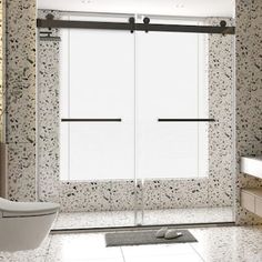 a bathroom with marble walls and flooring has sliding glass doors that open to let in natural light