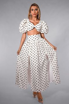 This two-piece set features a black and white polka dot mini top with a bow tie and puff sleeves, paired with a high-slit skirt. The playful polka dot pattern and charming bow add a touch of whimsy to your look. Crafted from high-quality materials, this outfit radiates sophistication and is perfect for various occasions, from brunch to evening soirees. Handmade customization Fabric composition: 90% polyester fiber, 10% spandex Washing method: hand wash or dry clean Popular elements: dot Comfy Sets, Mini Top, Polka Dot Skirt, Dot Skirt, Polka Dress, Polka Dot Pattern, Product Images, Modern Fashion, Flare Skirt