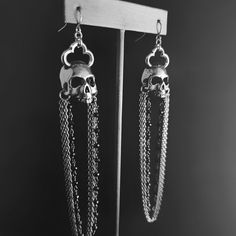 "Handcrafted & hand poured lead-free pewter skull with cathedral cross & black spinel rosary. Chandelier Skull is 1¼ L x ⅝\" W Overall length is 4.5\" Stud skull is ½\"W x ¾L They are hollowed as much as possible making them a comfortable weight." Edgy Silver Skull-shaped Jewelry, Edgy Silver Skull Jewelry, Gothic Skull Metal Earrings, Gothic Dangle Halloween Jewelry, Gothic Dangle Jewelry For Halloween, Metal Skull Jewelry With Skull Print, Gothic Sterling Silver Skull Earrings, Gothic Silver Jewelry With Skull Print, Gothic Halloween Jewelry With Oxidized Finish