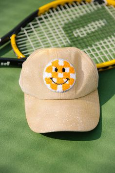 ORANGE AND WHITE SMILEY GOLD PATCH HAT HAT Judith March Trendy Gold Baseball Cap With Curved Brim, Trendy Adjustable Gold Baseball Cap, Trendy Gold Cap, Trendy Adjustable Gold Hats, Summer Gold Trucker Hat, Gold Baseball Cap For Summer, Trendy Gold Snapback Hat, Adjustable Gold Baseball Cap For Summer, Gold Adjustable Cap