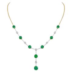 This remarkable necklace boasts 6.70 carats of Zambian emeralds displaying the crisp, verdant hue for which these gems are known for. Presented in platinum with 18K yellow gold, the vibrant Emeralds are complemented by lily-cut diamonds totaling 0.96 carats, exemplifying both artistry and craftsmanship. Round Necklace, Zambian Emerald, Emerald Necklace, Gorgeous Jewelry, Chains Necklace, Diamond Cuts, Platinum, Emerald, Lily