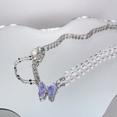 Embrace the beauty and symbolism of the butterfly with our Purple Butterfly Necklace. Made from titanium steel and glass beads, this necklace features a stunning butterfly pendant that's sure to make a statement. The purple color adds a touch of elegance and sophistication to any outfit, making it the perfect accessory for any fashion-forward individual. At a length of 45cm + extend 5cm, this necklace is both comfortable and stylish. And for a limited time, you can buy 3 necklaces and pay for 2 Trending Necklaces, Butterfly Bracelet, Buy Necklace, Necklace Beaded, Outfit Making, Purple Butterfly, Butterfly Necklace, Butterfly Pendant, The Butterfly