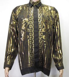 "GREEK STYLE SILK SHIRT European Style Dress Beautiful 100% Metallic Silk Shirt ,Black and Gold all over .Beautiful design . Hidden Gold Finish Buttons Men's Sizes : Small only Comfort Fit with Beautiful details all over Excellent condition Please see measurement for proper fitting or compare to one shirt that fit you good Unisex Adults TAG SIZE SMALL : Pit to Pit With the shirt lying flat : 22\" inches, Sleeve Length, measured from the top of the shoulder seam to the end of the arm cuff :23\" i Gold Long Sleeve Shirt With Graphic Print, Designer Long Sleeve Festive Shirt, Vintage Graphic Print Party Shirt, Silk Shirt Men, Versace Style, Baroque Style, Soccer Shirts, Baroque Fashion, European Style