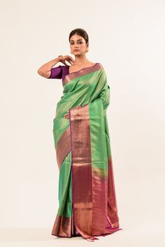 Explore our exquisite Pure Kanjivaram Silk Saree featuring a stunning dual shade of green and Maroon, adorned with intricate Zaris woven designs. Perfect for saree enthusiasts seeking timeless elegance. Green Pre-draped Saree With Meenakari For Puja, Green Pre-draped Saree With Zari Weaving For Diwali, Green Bollywood Pre-draped Saree With Meenakari, Green Paithani Silk Pre-draped Saree With Self Design, Designer Green Katan Silk Pre-draped Saree, Green Katan Silk Traditional Designer Wear, Green Pre-draped Saree With Zari Work In Katan Silk, Green Meenakari Banarasi Silk Pre-draped Saree, Elegant Green Zari Weaving Traditional Wear