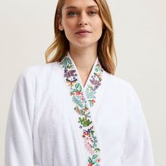 Jardins Robes by Yves Delorme. White terrycloth. Women’s bathrobe, Sizes S/M/L/XL. 83% organic cotton / 17% modal, 450 gsm. White Kimono with embroidered trim. Made in Turkey. Machine wash in cool water. Use gentle detergent and do not bleach. Tumble dry on low heat. Yves Delorme, White Kimono, Embroidered Trim, Terry Cloth, Bleach, Organic Cotton, Heat, Trim, Water