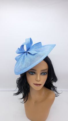 Elegant Blue sinamay Fascinator. Has clips for a secured and comfortable look.  This will be a great way to add elegance to any,  bridesmaid,  rehearsal dinner,  Wedding guest,  cocktail party, or church outfit. Also, comes in Hot Pink, blush, white, ivory and other colors - Ready to ship  - Free Shipping - Fast shipping - Customize by adding different color flowers and or feathers Check my store for for styles and colors.  Hatsandpearls.etsy.com Find more at my website: Www.hatsandpearls.com  Reach out to me if you can't find what you are looking for. I can make cake custom orders and help you style and match your outfit .  Send a picture of your dress and I will help you style it.  Thank you for visiting! Blue Fascinator With Short Brim For Summer, Blue Short Brim Fascinator For Summer, Summer Blue Fascinator With Short Brim, Blue Short-brimmed Fascinator For Summer, Brimmed Blue Fascinator For Spring, Adjustable Blue Fascinator For Summer, Blue Brimmed Fascinator For Spring, Blue Adjustable Fascinator For Summer, Adjustable Blue Headpiece With Curved Brim