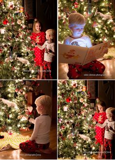 two children are reading a book in front of a christmas tree