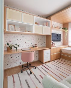 a room with a bed, desk and shelves on the wall next to a window