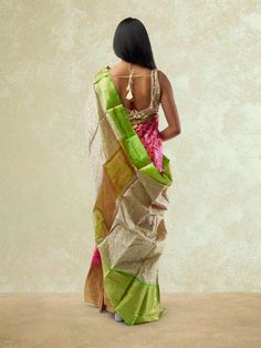 Embrace traditional elegance with our Pink and Green Fancy Patola Saree from the Sarees collection. This exquisite saree features a stunning combination of pink and green colors in a fancy Patola design, exuding grace and charm. The intricate detailing and vibrant hues make it a perfect choice for festive occasions and special events. Care Instructions: Dry clean only to maintain the fabric's quality and colors. Festive Pink Raw Silk Pre-draped Saree, Festive Pink Pre-draped Dola Silk Saree, Festival Banarasi Silk Pre-draped Saree With Tilla, Pink Pre-draped Saree With Dupatta In Tissue Silk, Transitional Pink Raw Silk Pre-draped Saree, Festive Pink Dola Silk Pre-draped Saree, Designer Wear Pink Pre-draped Saree For Transitional Seasons, Pink Bollywood Pre-draped Saree For Transitional Season, Pink Bollywood Transitional Pre-draped Saree