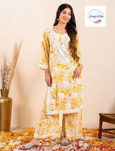 This is  soft hand-embroidered chikankari Kurti and palazzo set. It gives a very smooth feel to your skin and hand embroidery on this Kurti makes it set apart from other Kurtis. TOP Fabric - MulMul Neck Type: Round Neck BOTTOM FABRIC- rayon with hand embroidery  Size - Size Available - 38- 44 inch size is measured is Bust size. If you need any clarification regarding Size Please contact me Summer Chikankari Embroidery Straight Kurta Pant Set, Spring Mulmul Sharara With Straight Kurta, Anarkali Straight Kurta Pant Set For Spring, Spring Bollywood Sets With Chikankari Embroidery, Spring Chikankari Embroidered Palazzo Set With Straight Kurta, Spring Straight Kurta Sharara With Printed Motifs, Spring Straight Kurta Set With Gota Work, Spring Cotton Traditional Wear With Gota Work, Spring Resham Embroidered Straight Kurta Palazzo Set