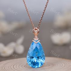 This Gorgeous Teardrop Titanic Ocean Blue Topaz Rose Gold Pendants Necklace designed with 14x20 boulder pear cut natural swiss blue topaz with Millennium Cut which looks more sparkle & clear. This Gorgeous Solid 18K Rose Gold Drop Topaz Moissanite Pendant is a great engagement or promise, cocktail party jewelry ◆ Product Specifications ※18K rose gold ※ Spring clasp ※ Pear shape 14x20mm swiss blue topaz,22 carat ※ round moissanite accents ※Spring ring clasp closure; cable or rope link chain ※Adju Pear-shaped Blue Topaz Jewelry As A Gift, Pear-shaped Blue Topaz Jewelry For Gifts, Pear Shaped Blue Topaz Jewelry Gift, Pear Shaped Blue Topaz Jewelry For Gifts, Cocktail Party Jewelry, Engagement Necklace, Moissanite Pendant, Gold Pendants, Pendants Necklace