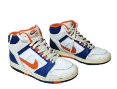 Nike Air Force 2 - Sz 11 High Top - White Blue Orange - New York NY Knicks Shoes Here is a pre-owned pair of Nike Air Force 2 size 11 lace-up high-top athletic sneakers.  White body with blue and orange for New York Knicks NBA basketball team fans. Style code 624006-181.  Orange Nike swoosh. Condition:  Uppers show some wear (see photos).  The soles have very minor wear.   Contact us with any questions regarding this pair of basketball shoes.  Shipped economy mail. No returns. ************** Check out our other items! Welcome to the Three Happy Sisters Store! We sell an eclectic variety of goods ~ dishes, collectibles and knickknacks, clothing, sporting goods, toys, books, art, jewelry . . . items of interest from A to Z.  Inventory changes almost daily, so be sure to check back frequently Nike Air Force 2, Nba Basketball Teams, Happy Sisters, Ny Knicks, Charles Barkley, Books Art, Basketball Team, Nike Swoosh, Nike Basketball