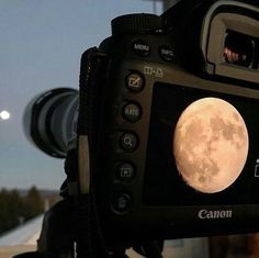 a camera with a full moon on the screen