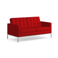 a red couch sitting on top of a white floor