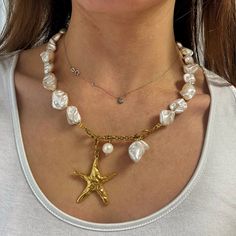 "Underwater Muse" necklace bridal edition  ⚜️super impressive summer Statement boho chic necklace .  This beautiful y lariat necklace  is made of pearly white irregular shape beads made of shells ( imitation pearls ) these beads are not fresh pearls but still made of natural elements known also as "shell pearl"   It is also decorated with a large gold plated 24k zamac star fish charm and a large freshpearl .  It easily closures at the front with a steel closure. Ideal Bohemia bridal jewelry.  It is a piece with a luxurious finish .  total length aprox 46 cm ( without the hanging part )  Star fish size aprox: 4.2 x 5 cm  it comes in two metal color tones . that means the metal details will be either in gold or silver tone . all rest parts remain the same  Nickel  free  🔆you may also check Bohemian Lariat Necklace With Clavicle Chain For Parties, Bohemian Lariat Pearl Jewelry, Elegant Pearl Drop Necklace For Summer, Elegant Summer Pearl Charm Necklaces, Bohemian Pearl Charm Party Jewelry, Pearl Pendant Necklaces For Beach, Summer Pearl Pendant Jewelry, Summer Pearl Necklace With Pearl Pendant, Summer Party Long Necklaces