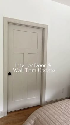 the interior door and wall trim update is shown in this bedroom with white walls, wood floors