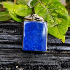 Pendant Info:-  Gemstone :- Lapis Lazuli Material :- 925 Sterling Silver Size :- 4.2 Centimetres (LENGTH With Loop), 2.2 Centimetres (Width) , 0.6 Centimetres (HEIGHT) Shape :- Rectangle Shape Weight :- 54.75 Carat (10.95 Gram) Lapis lazuli is a vivid blue gemstone that has been treasured for centuries for its striking color and potential metaphysical and healing properties. It's important to note that these benefits are often based on tradition and belief rather than scientific evidence. Here a Artisan Blue Rectangular Necklace, Blue Rectangular Spiritual Jewelry, Spiritual Blue Rectangular Jewelry, Blue Rectangular Jewelry With Natural Stones, Blue Rectangular Natural Stones Jewelry, Blue Rectangular Natural Stone Jewelry, Blue Lapis Lazuli Rectangular Jewelry, Blue Pendant Gemstones For Gift, Handmade Artisan Blue Gemstones