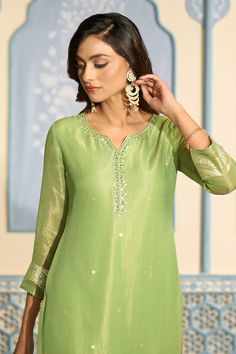 Light green tissue kurta featuring with sequins and mirror work on placket and all-over floral woven motifs. Comes with heavy Banarasi bordered dupatta and matching pant. - Aza Fashions Pista Green Palazzo Set With Mirror Work, Green Dola Silk Palazzo Set With Mirror Work, Green Dola Silk Sharara With Mirror Work, Pista Green Palazzo Set With Mirror Work For Diwali, Green Art Silk Sets With Mirror Work, Diwali Pista Green Palazzo Set With Mirror Work, Pista Green Straight Kurta With Mirror Work, Designer Green Churidar With Mirror Work, Green Sharara With Mirror Work And Straight Kurta