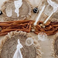 the table is set with place settings and napkins