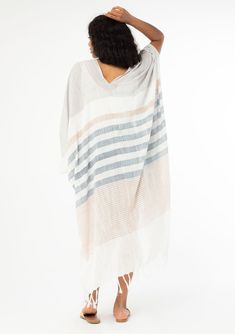 A versatile cotton bohemian beach kimono in a neutral stripe. FINAL SALE Mixed stripe print Cotton Relaxed, flowy fit Kimono sleeves Mid-length Fringe hemline Billowy silhouette Long & lightweight Open front Bohemian beach kimono From the beach to the streets, this lightweight cotton kimono adds an effortless feel to any outfit. Featuring a fringe hemline, an easy open front, and a relaxed, billowy fit. Model is 5'9, garment is O/S.Style: I-10933 Neutral Blue, Beach Kimono, Bohemian Beach, Cotton Kimono, Kimono Sleeves, Kimono Sleeve, Kimono Fashion, Fashion Poses, Stripe Print