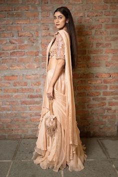 Beige pre-draped saree in a solid base with tiered layers and side drape. Comes with padded blouse embellished with 3D floral sequin and beads. - Aza Fashions Draped Saree, Padded Blouse, Drape Saree, Embellished Blouse, Beaded Neckline, Blouse For Women, Saree With Blouse, Aza Fashion, Blouses For Women