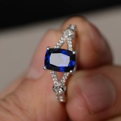 This is a gorgeous handmade creation. Its beauty is its simplicity & Elegance. The 6*8mm cushion cut lab sapphire is crafted in sterling silver with rhodium plated. It's made to order and it will take about 7-10 days to make it. All item is sent in a beautiful gift box You can realize more lovely stuff clicking the link https://www.etsy.com/shop/knightjewelry?refshopsection_shophome_leftnav Please leave the correct address and you phone number for delivering successfully. Sapphire Ring With Square Diamond Cut, Sapphire Cushion Cut Cubic Zirconia Ring, Lab-created Sapphire Rings In Square Cut, Square Cut Sapphire Ring With Diamond Detail, Sapphire Square Cut Ring With Accent Stones, Blue Square Cut Sapphire Promise Ring, Square Cut Blue Sapphire Promise Ring, Square Cut Sapphire Promise Ring, Silver Sapphire Ring With Cushion Cut