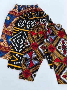 African print colorful boy shorts available from size 3 months to 10 Item may be slightly different than the on advertised due to the cut of the fabric Multicolor Printed Cotton Bottoms, Multicolor Printed Cotton Pants, Printed Yellow Cotton Bottoms, Yellow Printed Cotton Bottoms, Multicolor Cotton Sets With Long Pants, Multicolor Cotton Long Pants Set, Casual Multicolor Sets With Elastic Waistband, Ankara Pants, Upper Darby