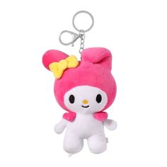 a pink hello kitty keychain with a yellow bow on it's head