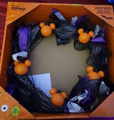 a mickey mouse halloween wreath in a box