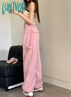 SPECIFICATIONS Style: Casual Age: JUNIOR Season: Summer Waist Type: HIGH Decoration: NONE Elasticity: Non Strech Fabric Type: Broadcloth Pattern Type: Solid Pant Style: Wide Leg Pants Material: Polyester Size S Waist 62 cm Hips 94 cm Length 99 cm M Waist 66 cm Hips 98 cm Length 100 cm L Waist 70 cm Hips 102 cm Length 102 cm XL Waist 74 cm Hips 106 cm Length 103 cm The above dimensions are measured manually in kind, and there will be a 1-3cm error due to different measurement methods. The relevan Spring Baggy Wide Leg Pants With Side Pockets, Spring Baggy Solid Color Cargo Pants, Spring Baggy Cargo Pants In Solid Color, Casual Baggy Pink Parachute Pants, Casual Pink Baggy Parachute Pants, Casual Pink Parachute Pants With Side Pockets, Pink Baggy High-waisted Parachute Pants, Pink High-waisted Cotton Parachute Pants, Casual High-waist Solid Color Cargo Pants