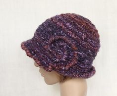 Crochet purple with multicolor (rust brown, lilac, dark grey) winter hat for women. Materials - different yarns with different chemical composition. Common fiber content : 30 % sheep wool, 7 % alpaca wool. 7 % silk, 1 % viscose, 46 % acrylic, 2 % polyamide. Size 57 - 60 cm (22 1/2 - 23 1/2 in.). Wide Brim Purple Winter Hat, Purple Wide Brim Winter Hat, Brimmed Yarn Cloche Hat For Winter, Yarn Brimmed Cloche Hat For Winter, Winter Yarn Brimmed Cloche Hat, Winter Yarn Cloche Hat With Brim, Winter Hand Knitted Cloche Hat, Purple Winter Hat With Curved Brim, Warm Purple Crochet Hat For Winter