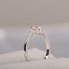 ◆The ring draws inspiration from the polaris. Hand-finished in Sterling sliver, this piece features a round shaped pink quartz. Clear zirzons decorate around the main stone. An extremely simple celestial ring that you cannot miss. ◆ Production Description: Main stone Type: Pink Quartz Main Stone Shape: Round Main Stone Size: 6*6mm Side stone: CZ Metal: 925 Sterling silver - Other options available in the drop down menu ◆ Customization: √Free for Add Engraving √Other Metal Type Available √Other G Pink Round Stone Promise Ring, Pink Sterling Silver Moonstone Promise Ring, Pink Sterling Silver Crystal Ring, Pink Moonstone Sterling Silver Ring For Anniversary, Elegant Pink Moonstone Sterling Silver Ring, Pink Sterling Silver Promise Birthstone Ring, Morganite Crystal Promise Ring, Pink Sterling Silver Promise Ring With Birthstone, Round Rose Quartz Promise Ring