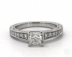 a princess cut diamond engagement ring with pave set shoulders